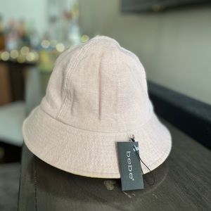 Bebe  NWT bucket hat. Multi color pink/orange canvas hat. Size medium.
